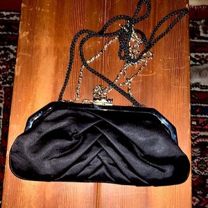 Black Statin Clutch Handbag with a Jeweled Push Lock Closure